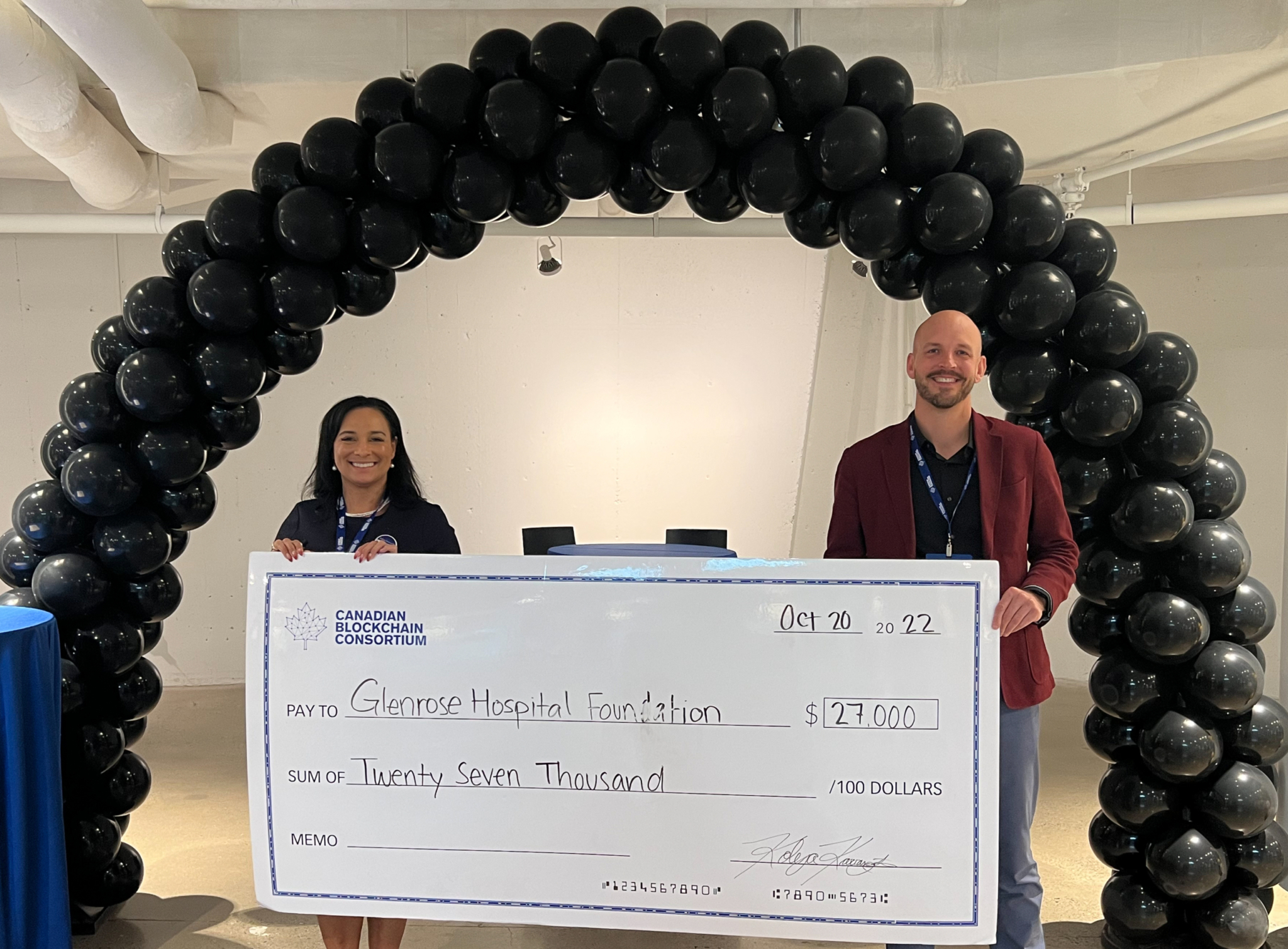 Photo of a man and woman standing with an oversized cheque, made out to the Glenrose Hospital Foundation in the amount of $27,000