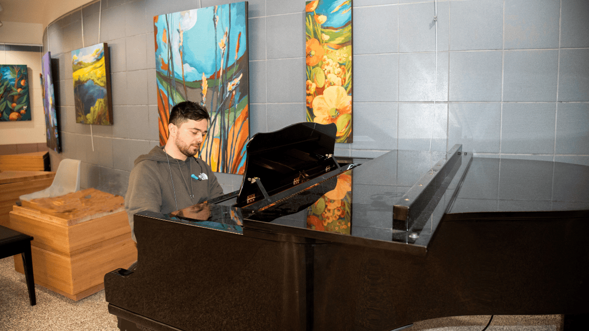 Pianist Riccardo Baldini plays the piano at the Glenrose Rehabilitation Hospital