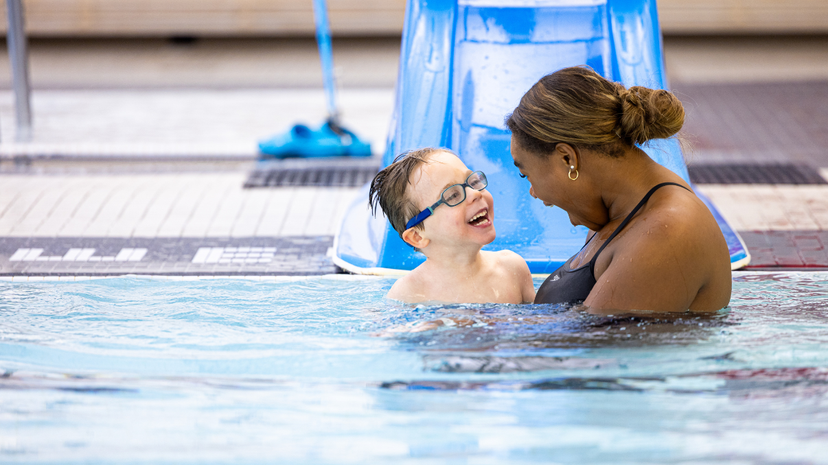 Glenrose pediatric patient, Hudson, and recreation therapist enjoy aqua therapy
