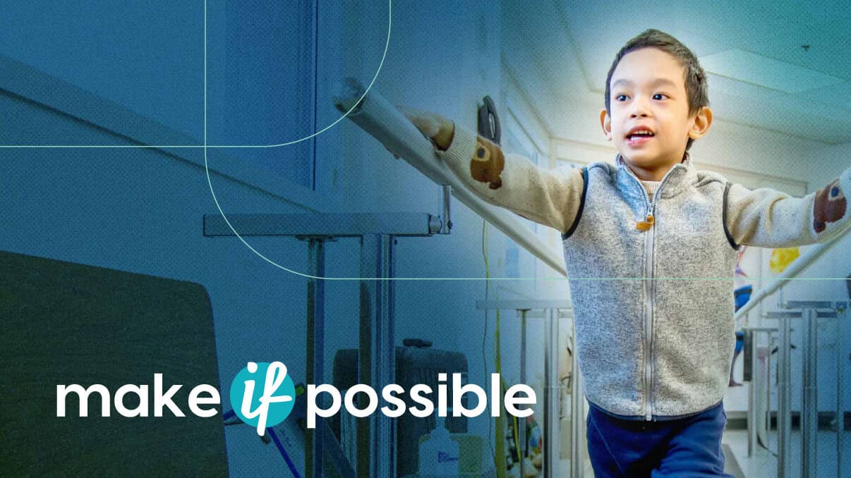 Bright young girl in hospital corridor with arms outstretched, promoting hope and healing at Glenros.