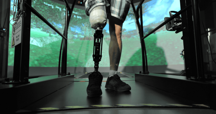 Veteran using a prosthetic leg in a virtual reality therapy session at Glenrose Hospital.