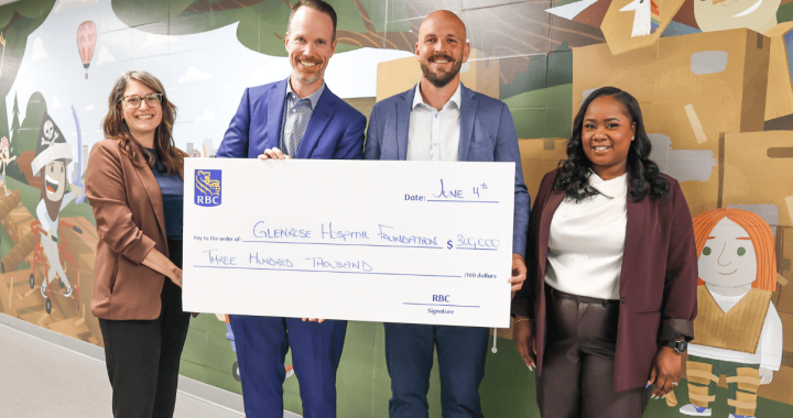 A healthcare professionals presenting a donation check at Glenrose Hospital Foundation event.