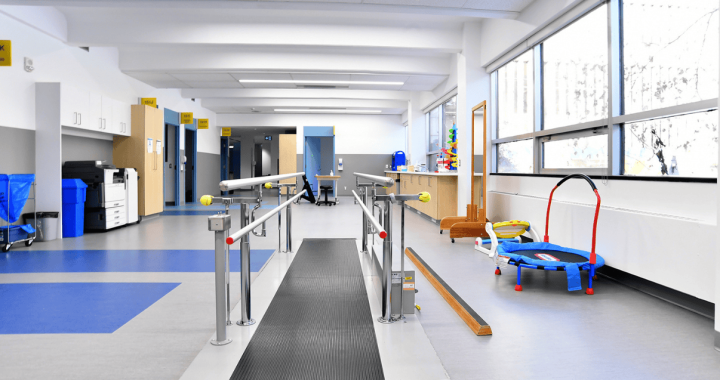 Modern children's therapy room at Glenrose Hospital with play equipment and therapy tools.