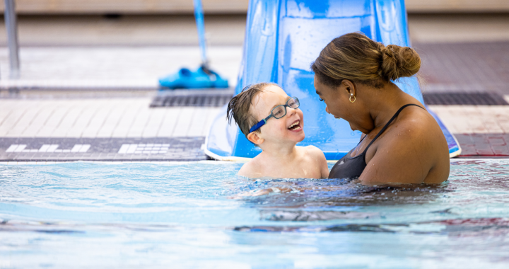 Glenrose pediatric patient, Hudson, and recreation therapist enjoy aqua therapy