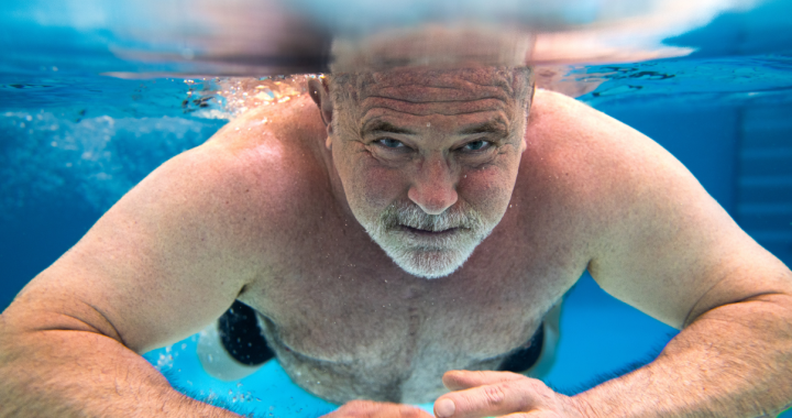 Physician and former Glenrose patient, Dr. Rob Agostinis, swims underwater