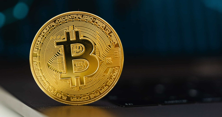 Gold bitcoin image on a dark background